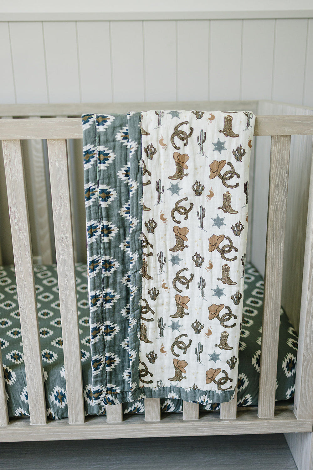 Southwest Aztec Outlaw Cowboy muslin quilt for babies, perfect for swaddling and cozy comfort.