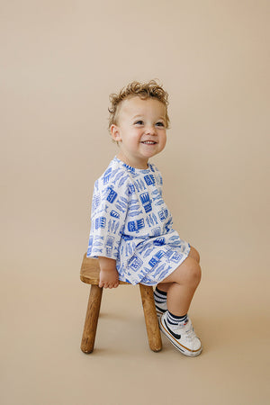 Baby shorts set featuring a sardine print, angled view showcasing vibrant colors and playful design.