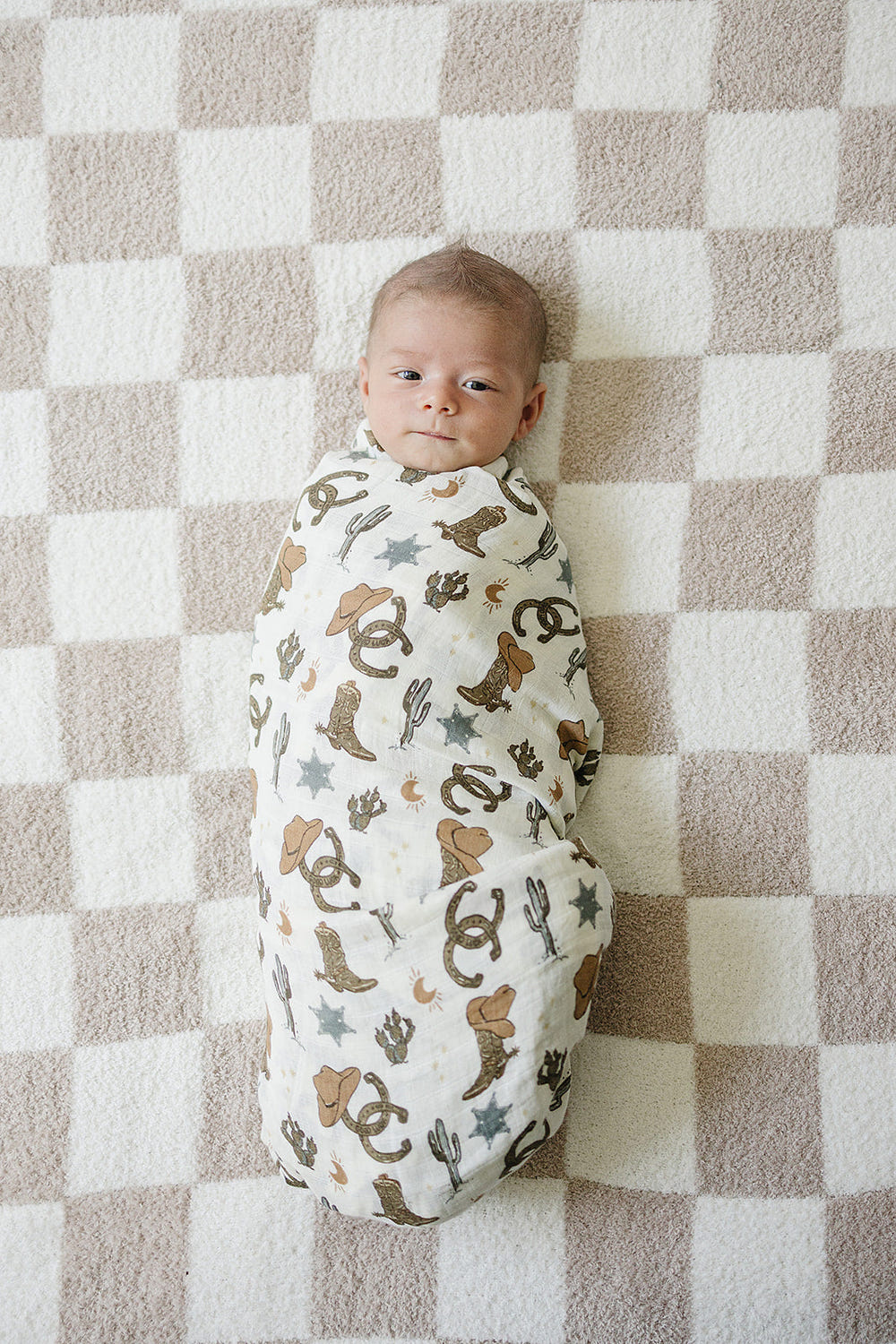 Outlaw Cowboy Muslin Swaddle Blanket for babies - soft, breathable, and stylish for cozy swaddling.