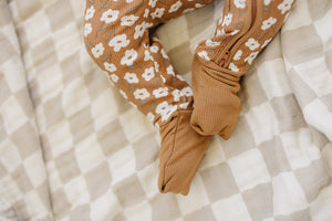 Mustard floral ribbed bamboo zipper bedding for babies, showcasing a cozy and stylish sleep solution.