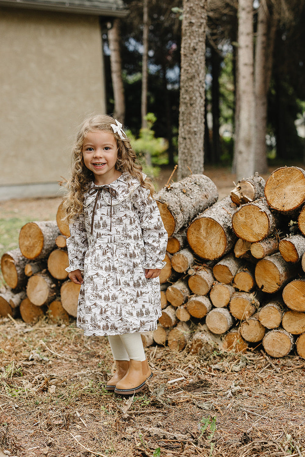 Brown toile dress for babies, perfect for special occasions and everyday wear.