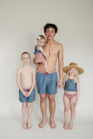 Men's swim shorts featuring a stars and stripes design, shown from angle 3. Perfect for summer beach days.
