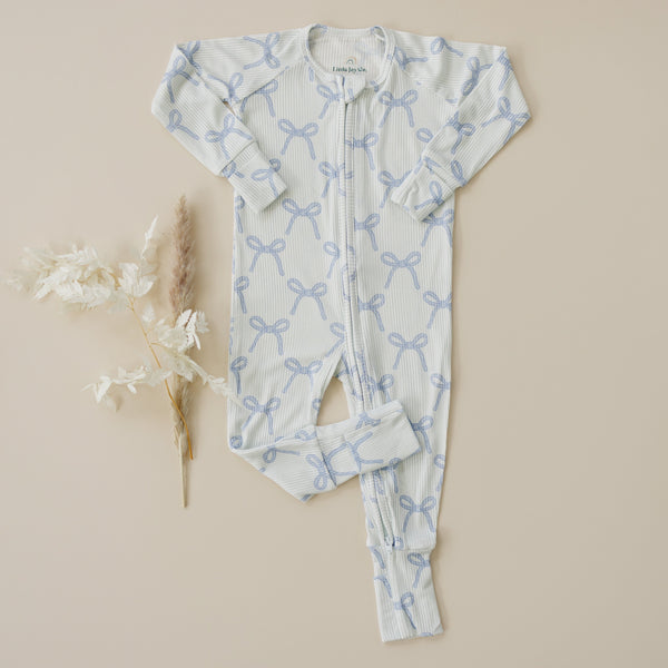 Blue Belle Ribbed Bamboo Zippy Pajamas for babies, angle view showcasing soft fabric and stylish design.