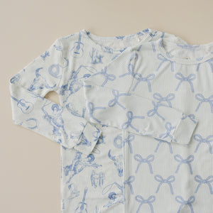 Blue Belle Ribbed Bamboo Zippy Pajamas for babies, shown from angle 3, soft and stylish sleepwear.