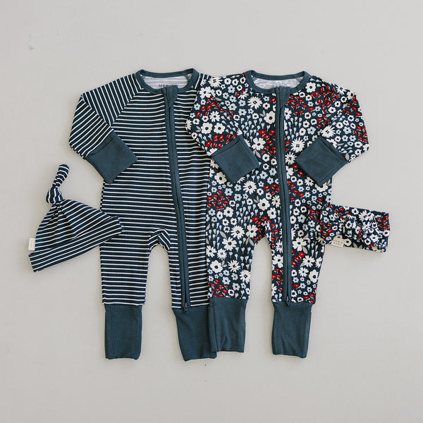 Americana Floral Ribbed Bamboo Zipper Pajamas for babies, showcasing a vibrant floral design in a cozy fit.