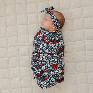 Americana Floral Ribbed Bamboo Stretch Swaddle in angle view, perfect for cozy and stylish baby wraps.