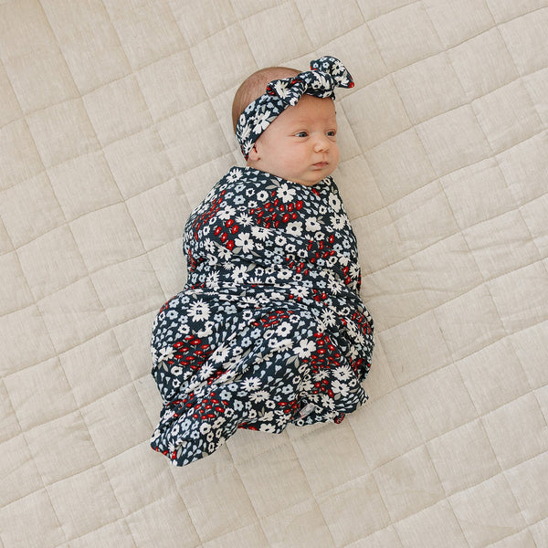 Americana Floral Ribbed Bamboo Stretch Swaddle in angle view, perfect for cozy and stylish baby wraps.