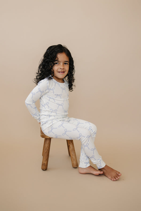 Blue Belle 2pc ribbed bamboo pajamas for babies, cozy and stylish sleepsuit set in soft blue, angle view.
