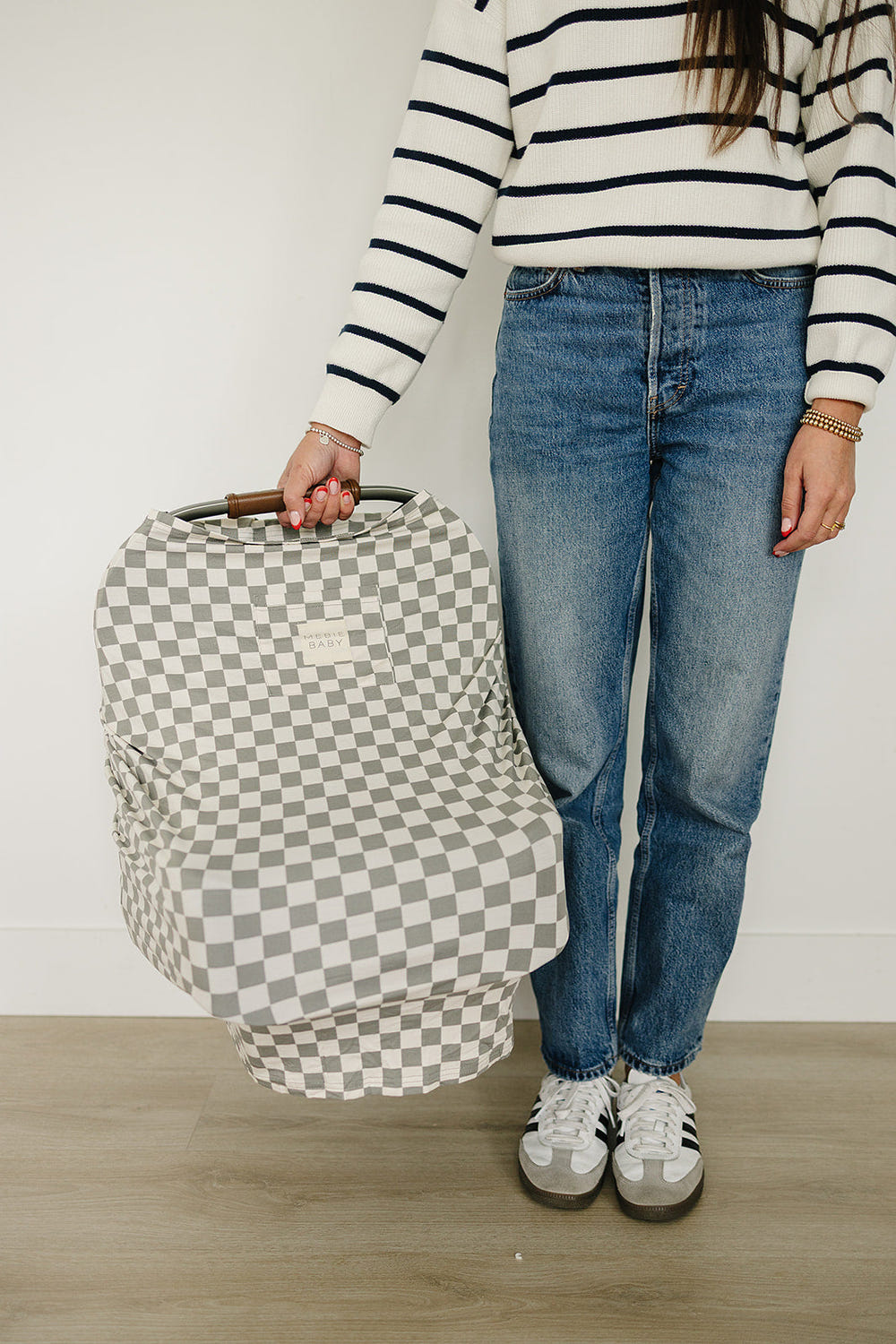 Light green checkered bamboo multi-use cover for babies, perfect for nursing, stroller, and car seat use.