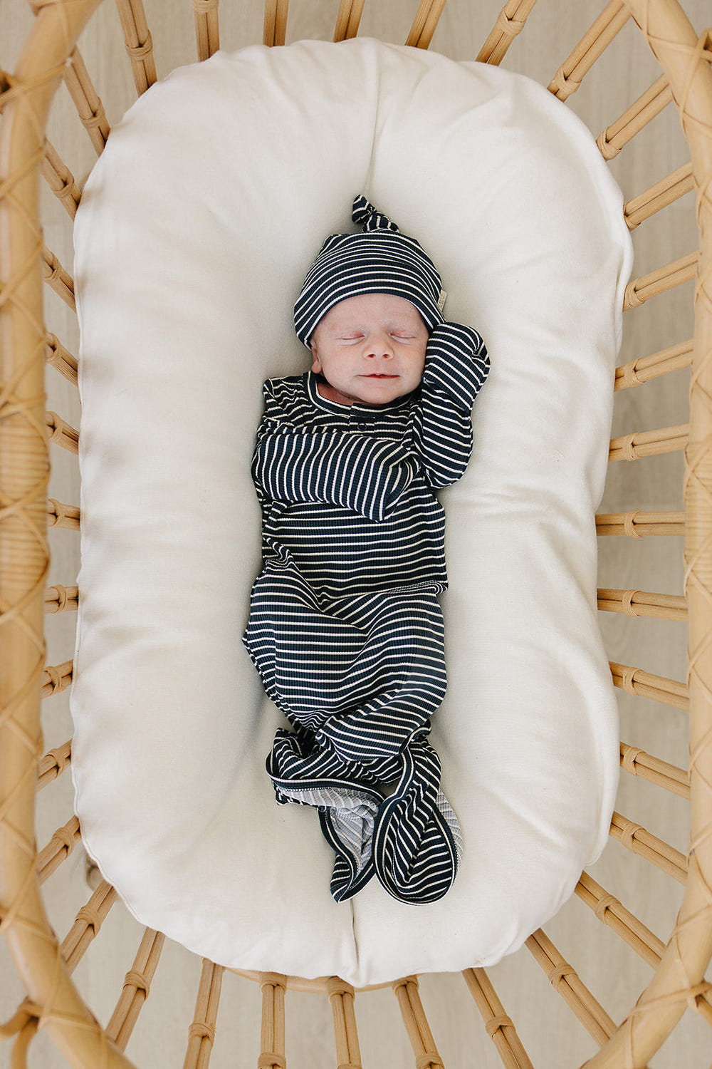 Navy stripes bamboo knot gown for babies, perfect for swaddling and comfort.