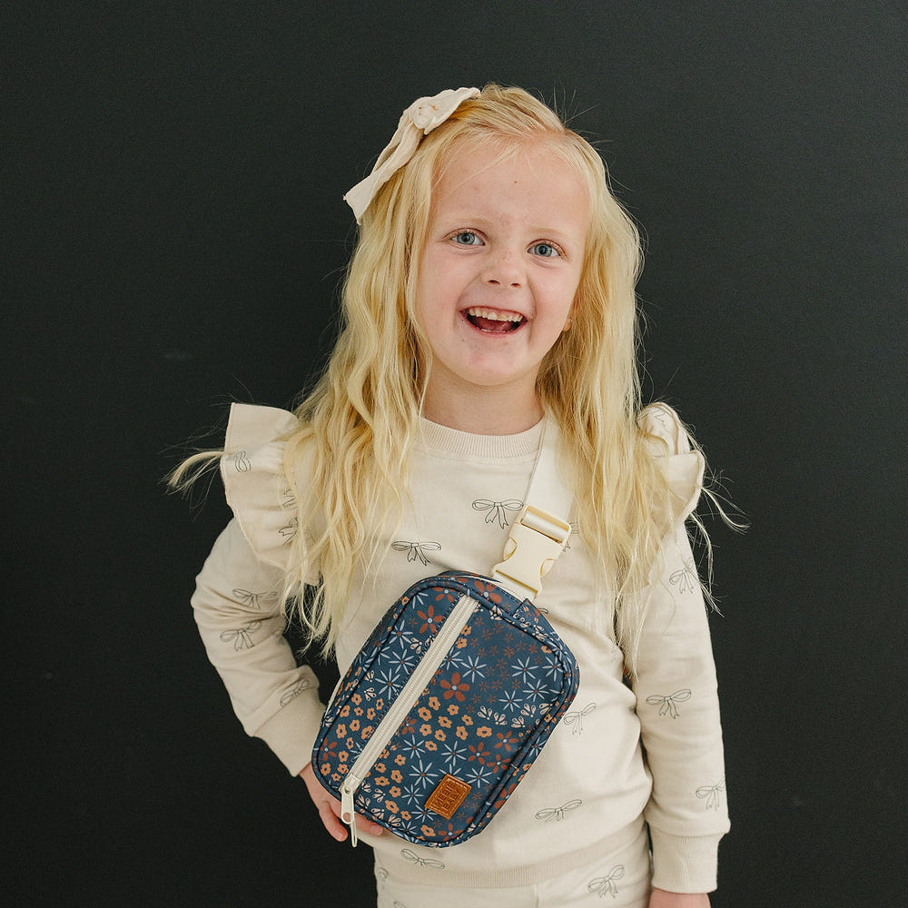 Navy floral mini fanny pack for babies, stylish and functional accessory for little ones.