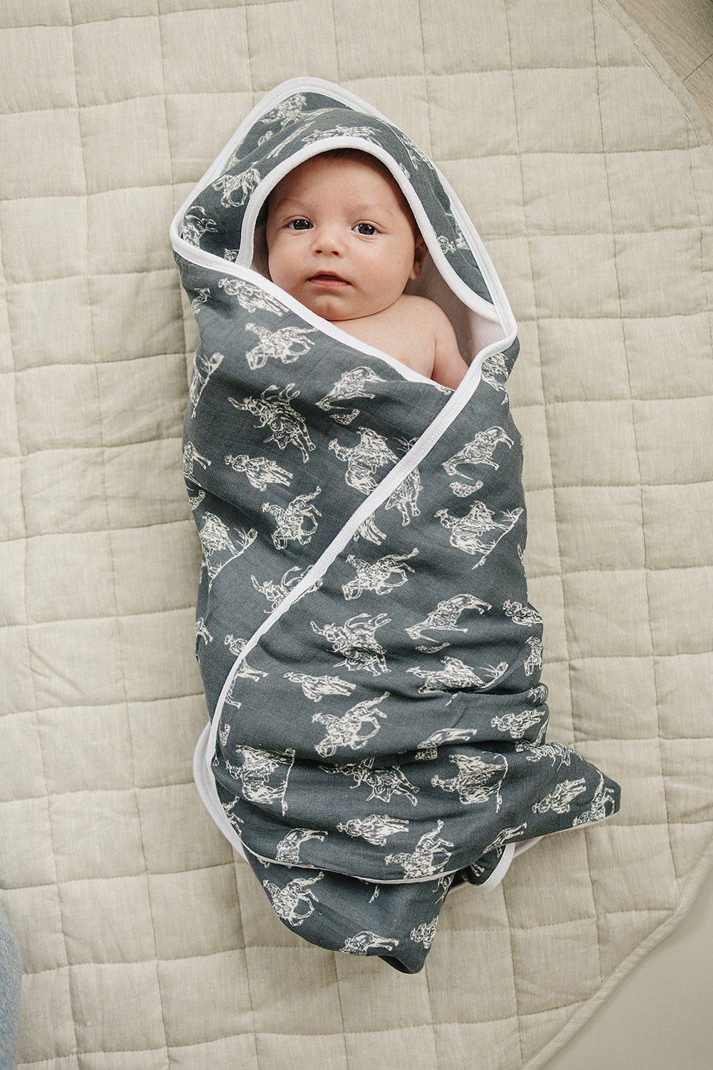 Wild West Muslin Hooded Towel for babies, featuring a charming design and soft, absorbent fabric.