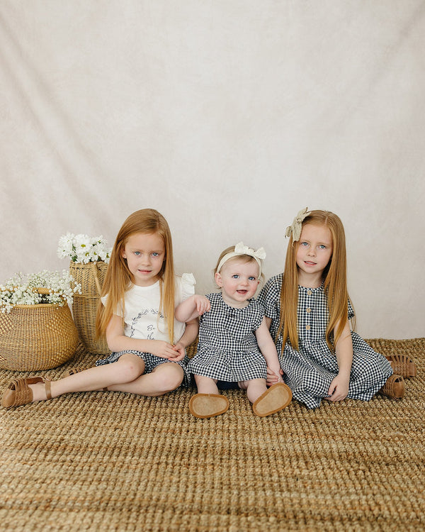 Navy gingham linen cotton dress for babies, stylish and comfortable, showcased from angle 7.