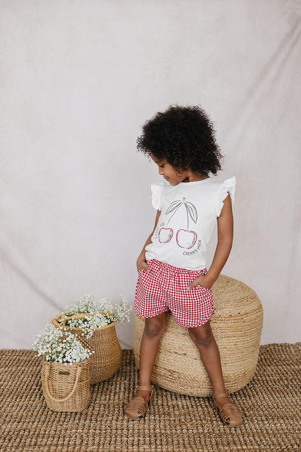 Cherry Ruffle Tee for babies, featuring a cute design and soft fabric, perfect for stylish comfort.