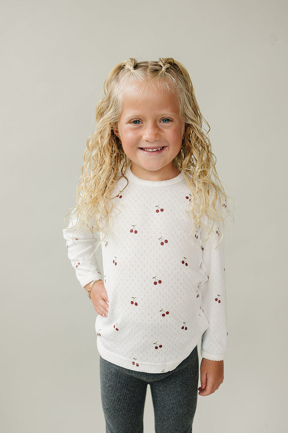Cherry Pointelle Long Sleeve Tee for babies - soft, stylish, and perfect for layering in any season.