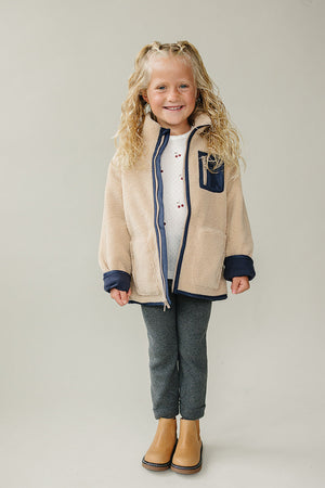 Sherpa zip-up jacket for babies, cozy and stylish, shown from angle 3. Perfect for warmth and comfort.