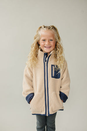 Sherpa zip-up jacket for babies, cozy and stylish, shown from angle 2. Perfect for warmth and comfort.