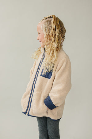 Cozy Sherpa zip-up jacket for babies, shown from angle 5, perfect for warmth and style in chilly weather.