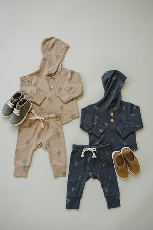 Cactus hooded baby set in two-piece bundle, featuring soft fabric and playful design, angled view.