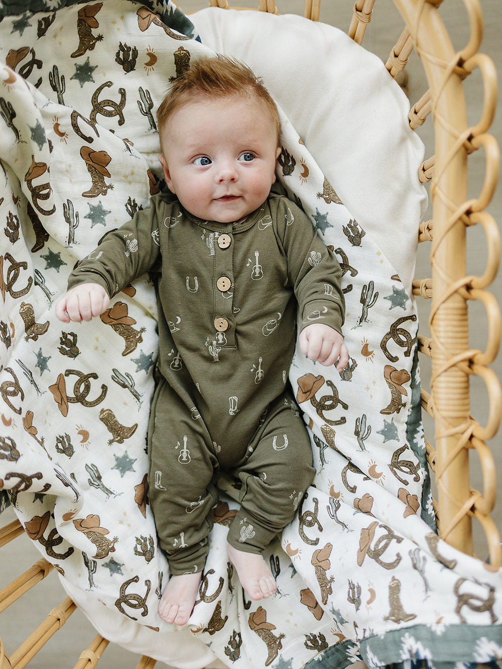 Nashville Long Sleeve Button Romper for babies, stylish and comfortable clothing for little ones.