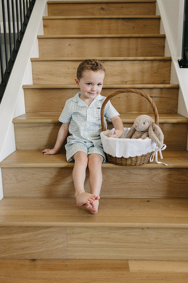 Light blue gingham short pajama set for babies, perfect for comfortable sleep and cozy bedding.