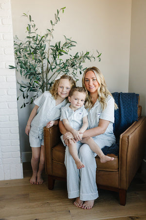 Light blue gingham short pajama set for babies, perfect for comfortable sleep and cozy nights.