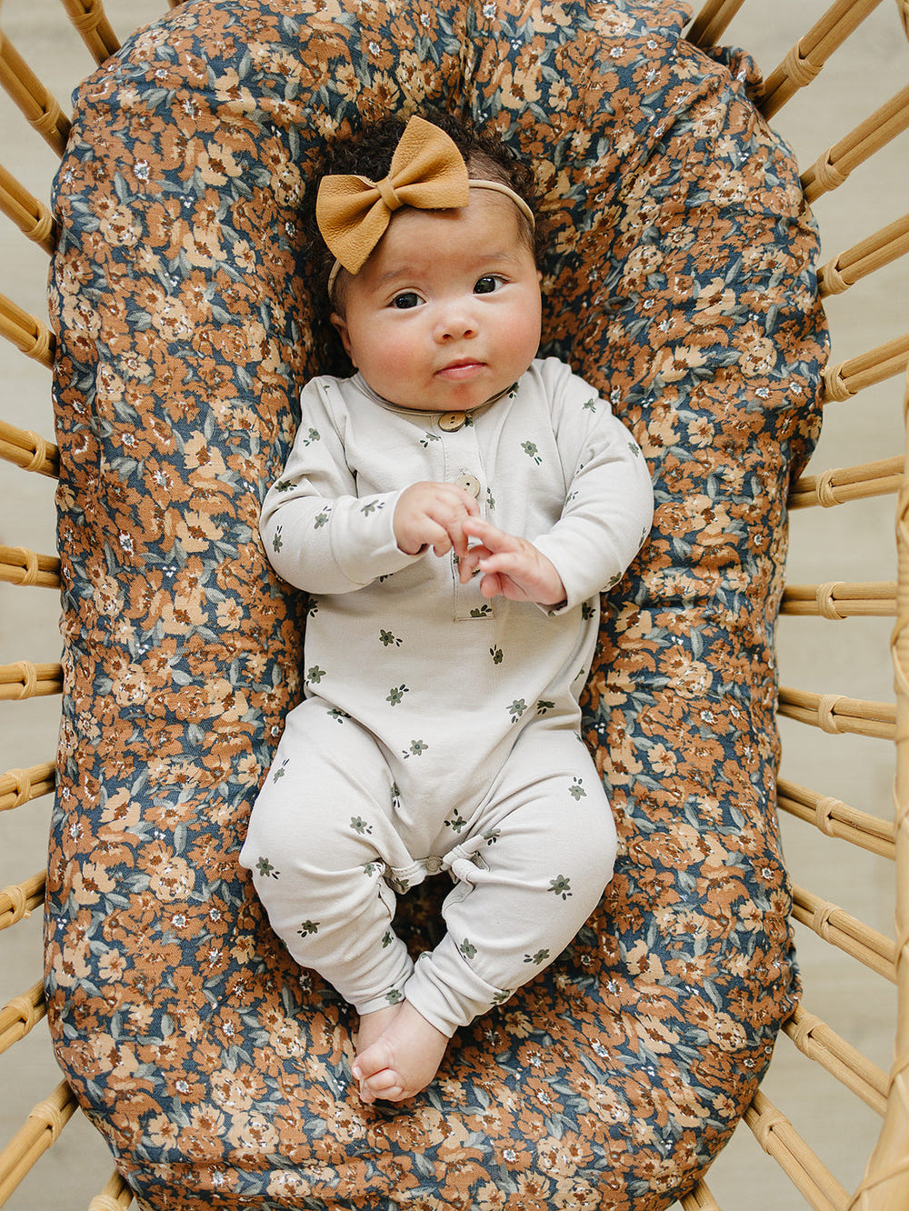 Floral long sleeve button romper for babies, perfect for stylish and comfortable playtime.
