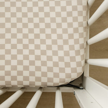 Taupe checkered bamboo stretch crib sheet for comfortable baby bedding and sleep.