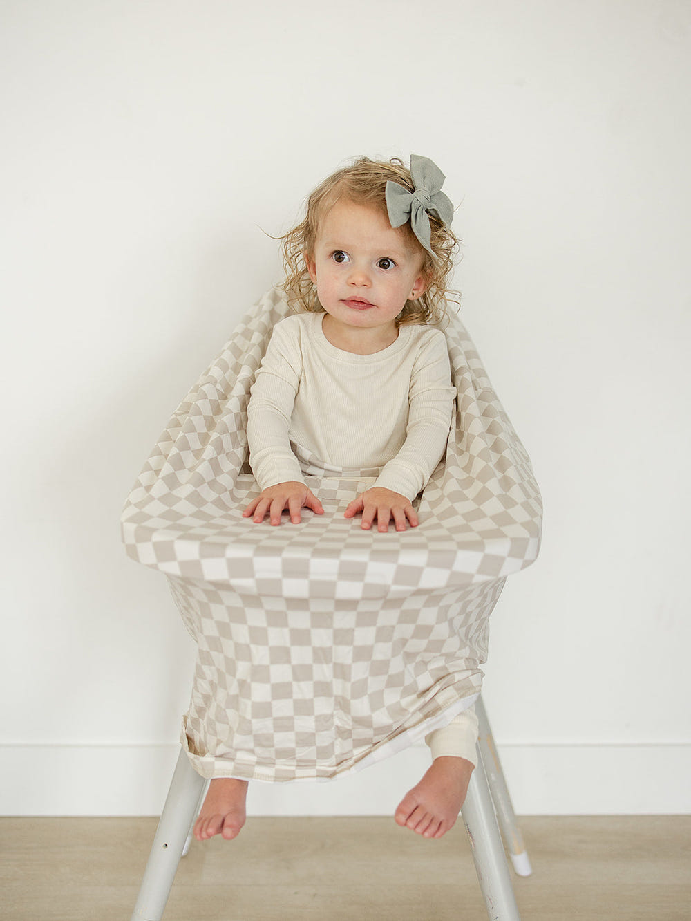 Taupe checkered bamboo multi-use cover for babies, perfect for nursing, stroller, and car seat use.