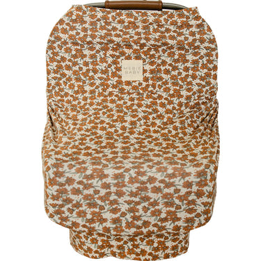 Cream Magnolia Bamboo Multi-Use Cover for babies, versatile and stylish for nursing, stroller, and shopping cart use.