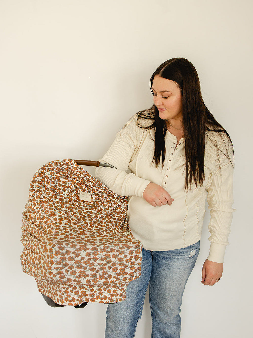 Cream Magnolia Bamboo Multi-Use Cover for babies, versatile and stylish for nursing, stroller, and shopping cart use.