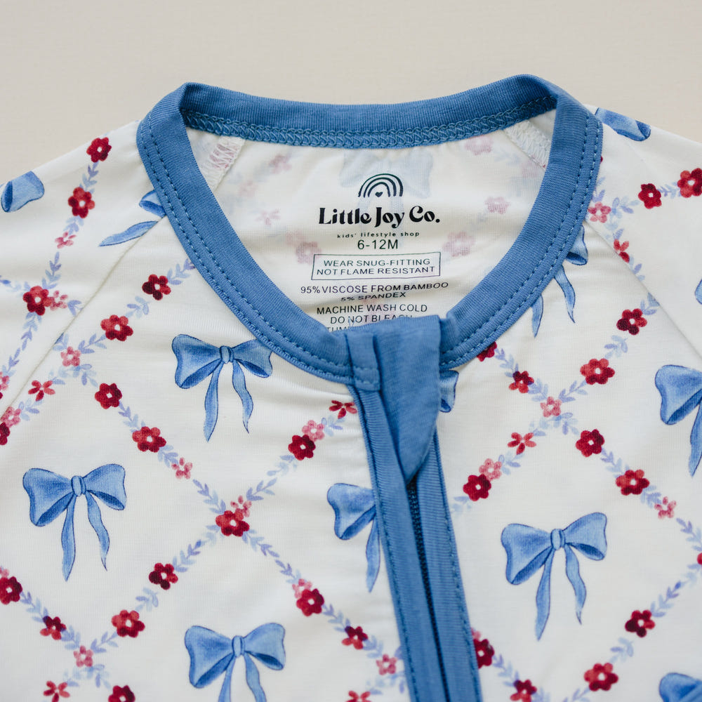 Red White & Bows Bamboo Zippy Pajamas for babies, featuring a cute design and soft, breathable fabric.