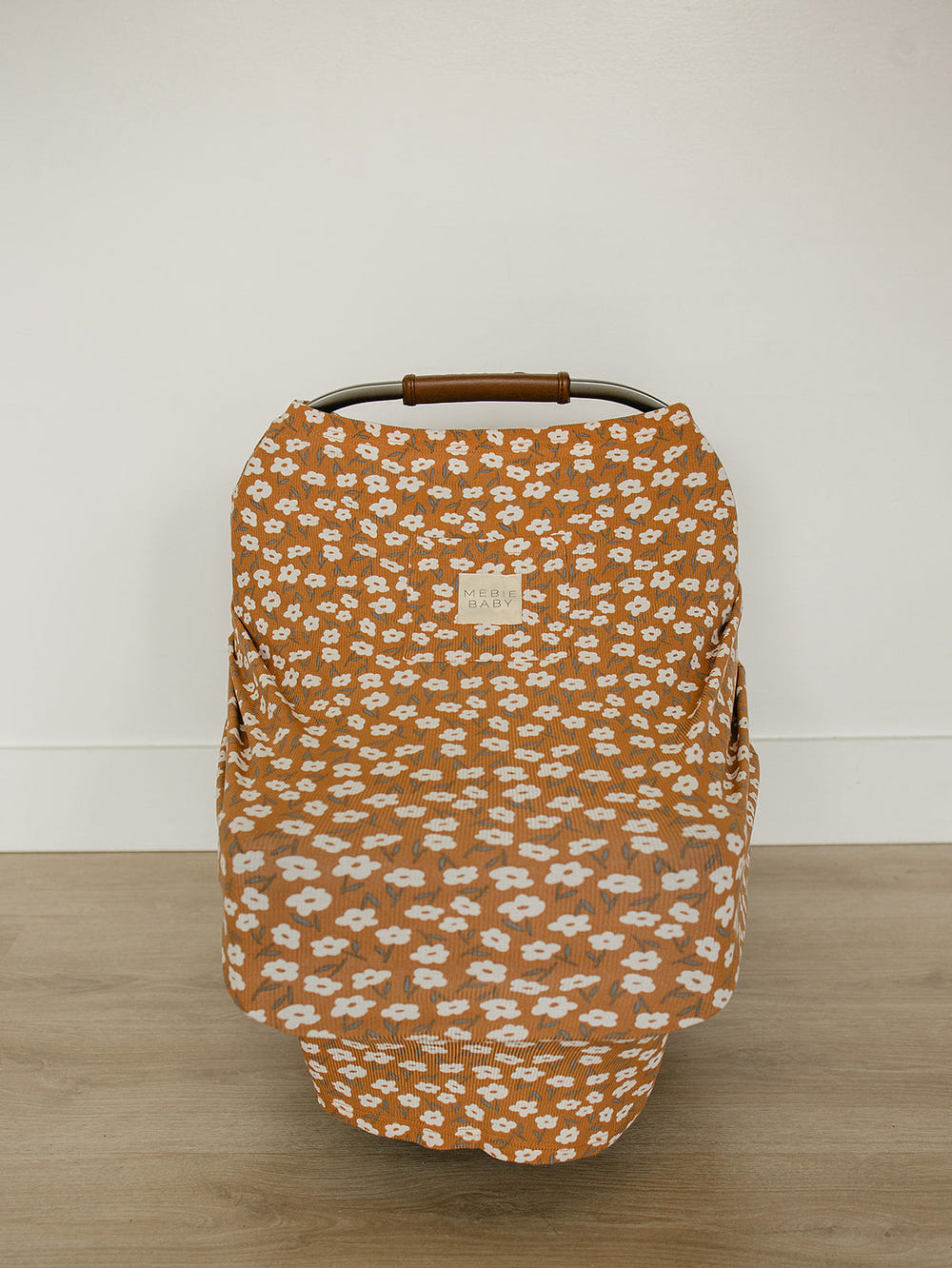 Mustard floral bamboo multi-use cover for babies, perfect for nursing, stroller, and car seat use.