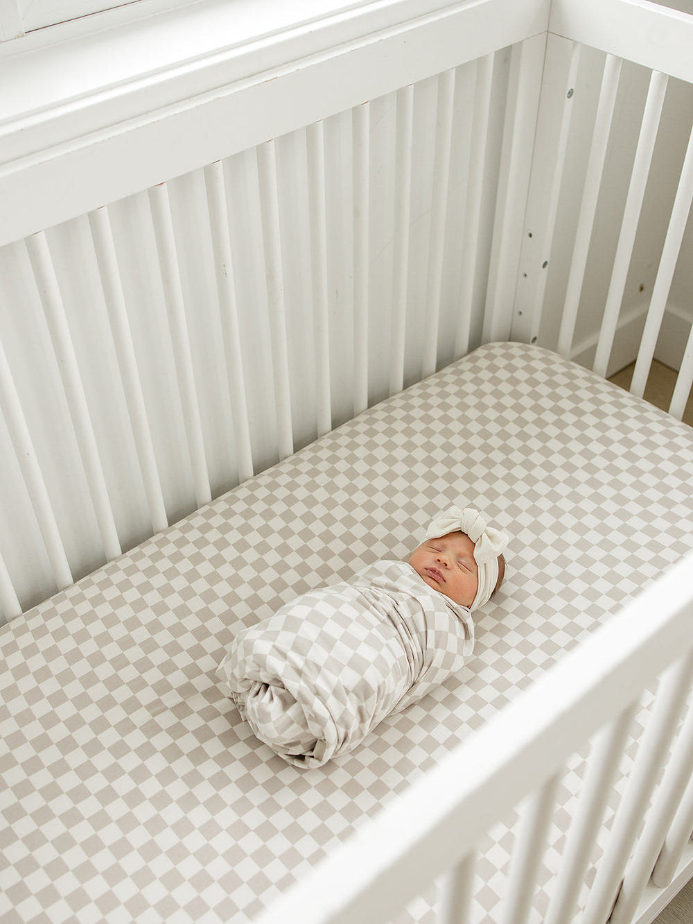 Taupe checkered bamboo stretch crib sheet for comfortable baby bedding and sleep.