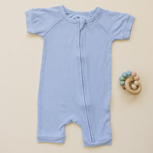 Solid ribbed bamboo shorty romper in various colors, displayed at angle 8, perfect for stylish baby outfits.