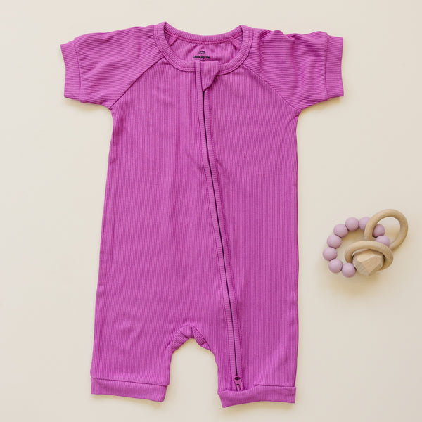 Solid ribbed bamboo shorty romper in various colors, angle view showcasing soft fabric and stylish design for babies.