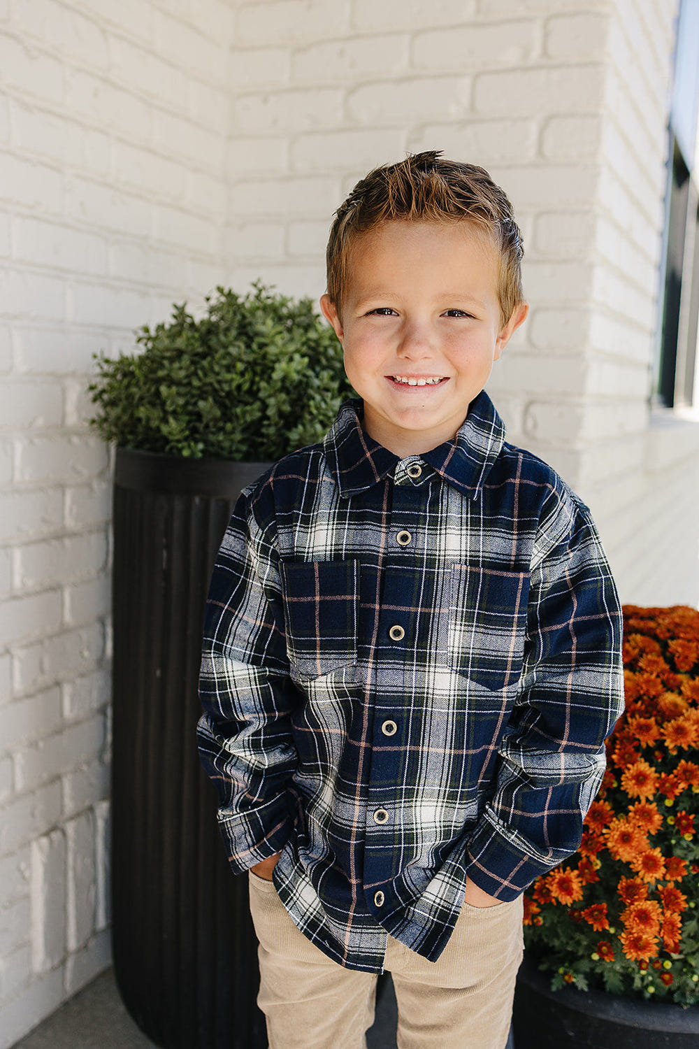 Navy plaid button-up shirt for babies, perfect for stylish and comfortable everyday wear.