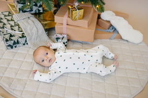 Tiny Trees Ribbed Bamboo Zippy Pajamas for babies, cozy sleepwear in soft bamboo fabric, angle view.