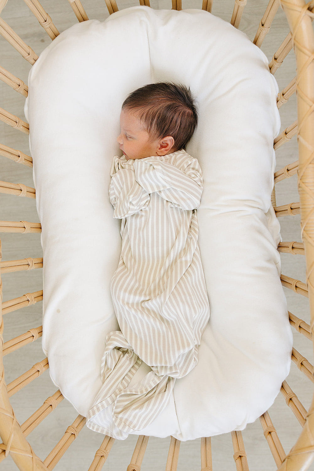 Taupe stripe ribbed bamboo knot gown for babies, perfect for comfortable sleep and stylish bedding.