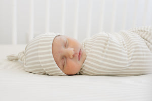 Taupe stripe ribbed bamboo stretch swaddle for babies, perfect for cozy sleep and comfort. Angle 3 view.