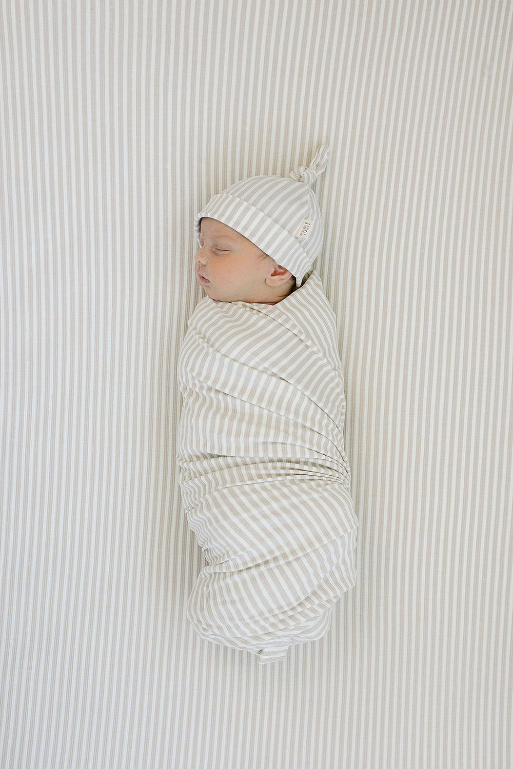 Taupe stripe ribbed bamboo stretch crib sheet for comfortable baby bedding and sleep.