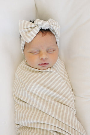 Taupe stripe ribbed bamboo stretch swaddle for babies, perfect for cozy sleep and comfort.