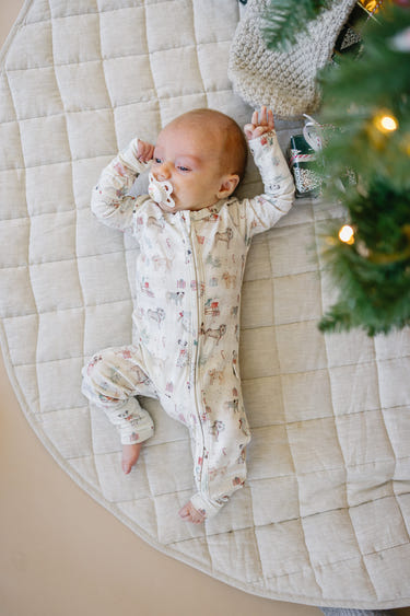 Santa Paws Bamboo Zippy Pajamas for babies, featuring festive design and soft, breathable fabric. Perfect holiday sleepwear!