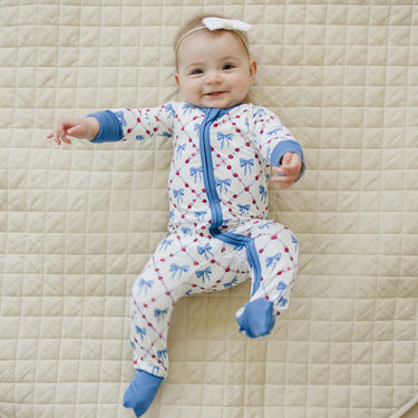Red White & Bows Bamboo Zippy Pajamas for babies, featuring a cute design and soft, breathable fabric.