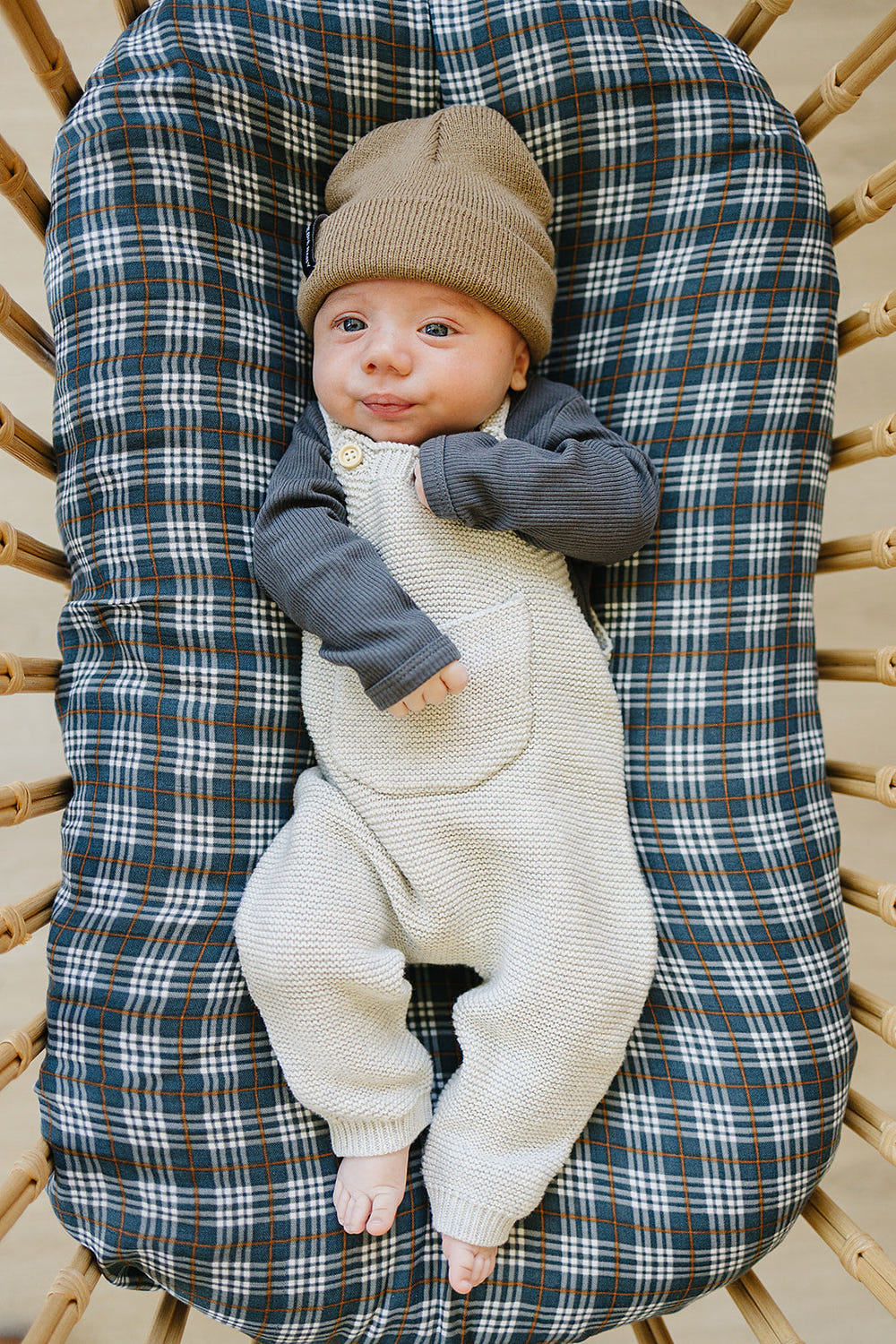Grey knit overalls for babies, perfect for comfort and style in rompers and overalls category.