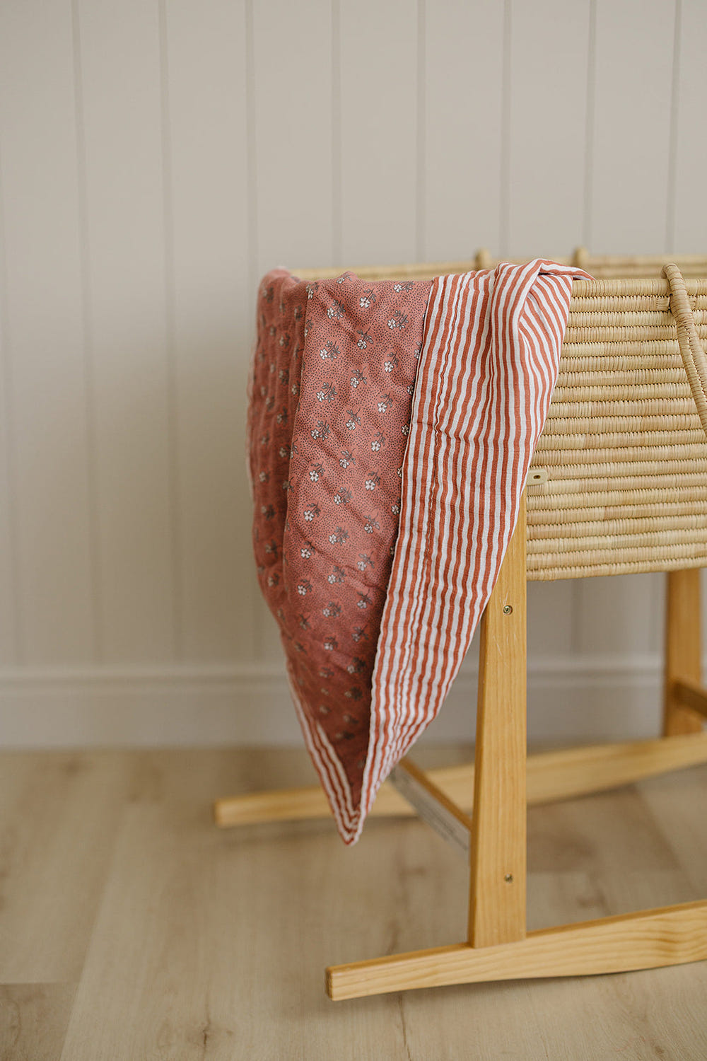 Vintage pink floral and pink stripes muslin quilt for baby bedding and sleep. Soft, stylish, and perfect for nursery decor.