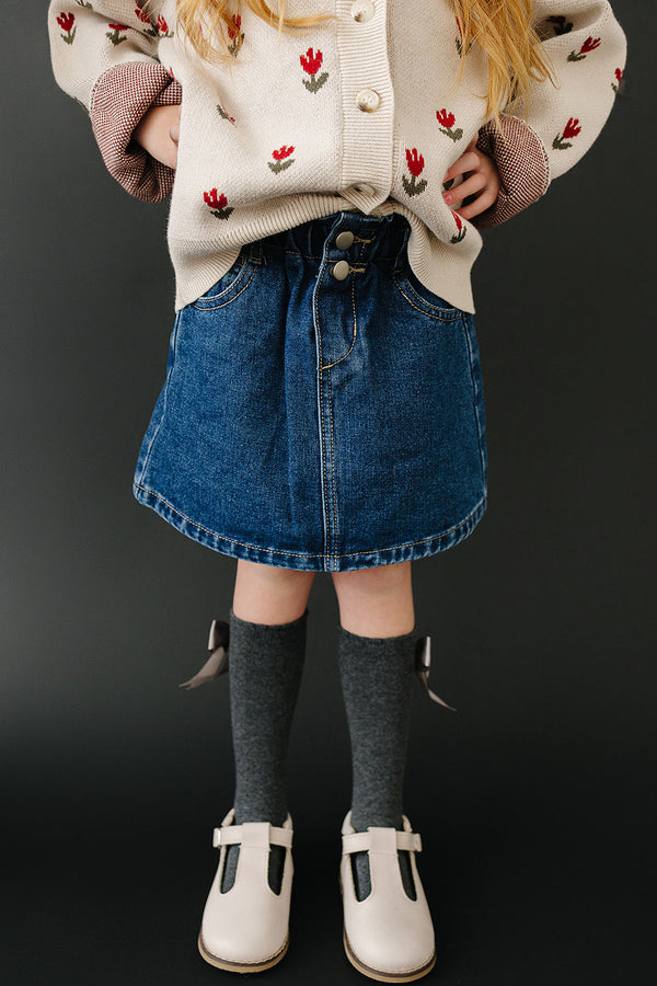 Dark wash denim skirt for babies, stylish and comfortable, shown from angle 2. Perfect for casual outfits.