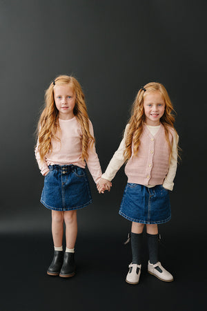 Dark wash denim skirt for babies, stylish and comfortable, perfect for everyday wear. Angle 6 view.