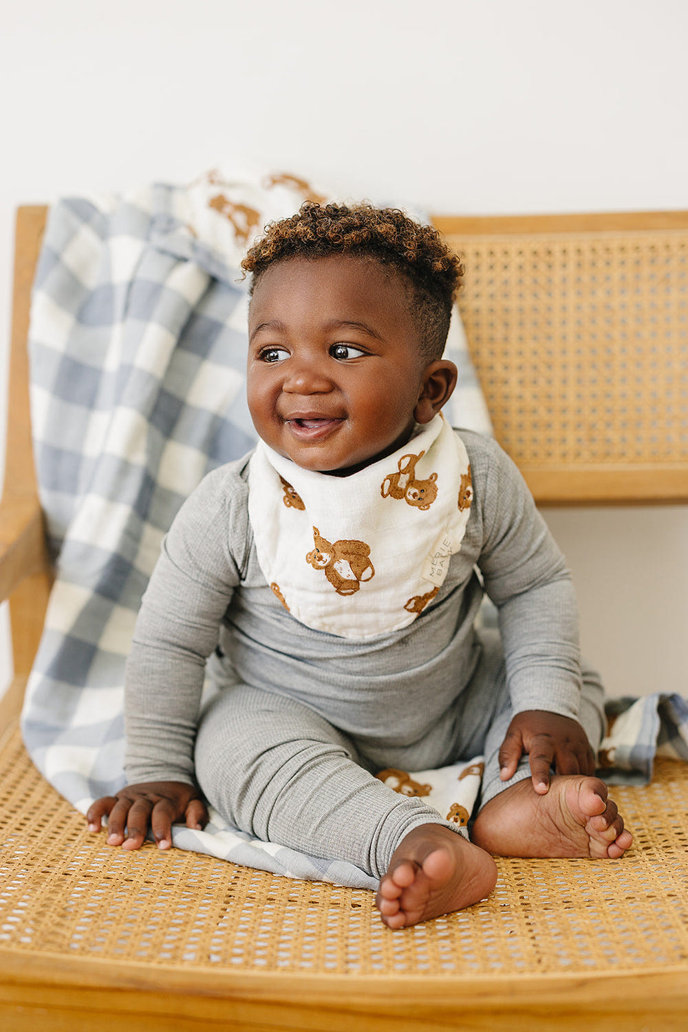 Classic muslin bib featuring a cute teddy bear design for babies, perfect for mealtime messes.