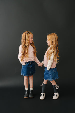 Dark wash denim skirt for babies, stylish and comfortable, perfect for everyday wear. Angle 7 view.